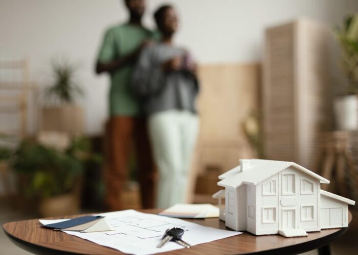 new-home-keys-plan-table-with-defocused-couple (1) new-home-keys-plan-table-with-defocused-couple (1)
